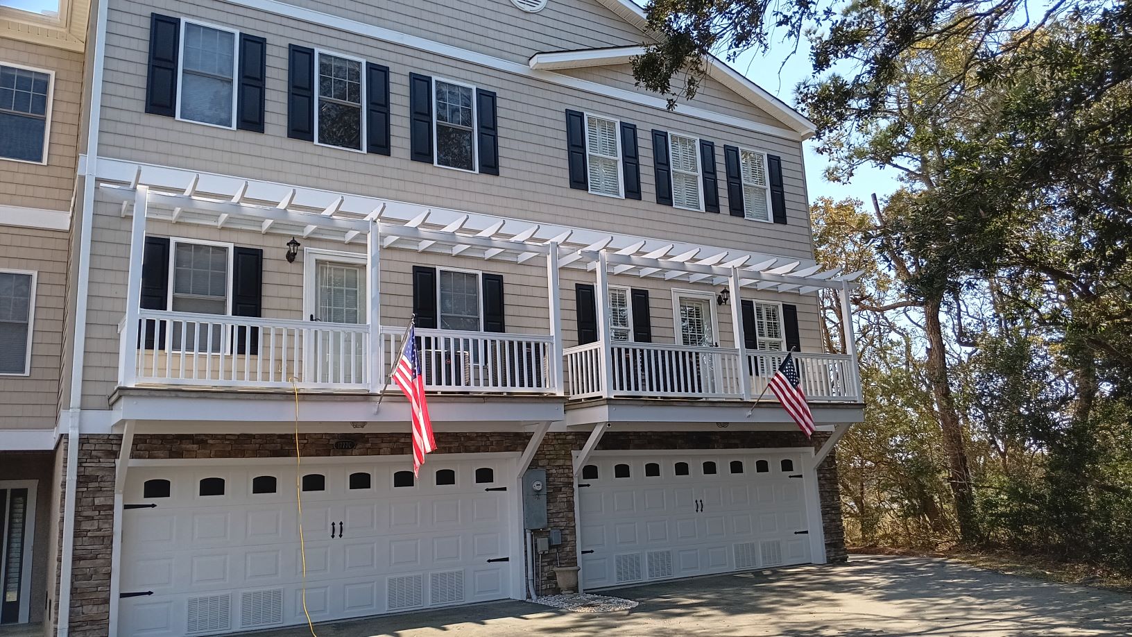 Freshly painted charcoal exterior wall with crisp white trim