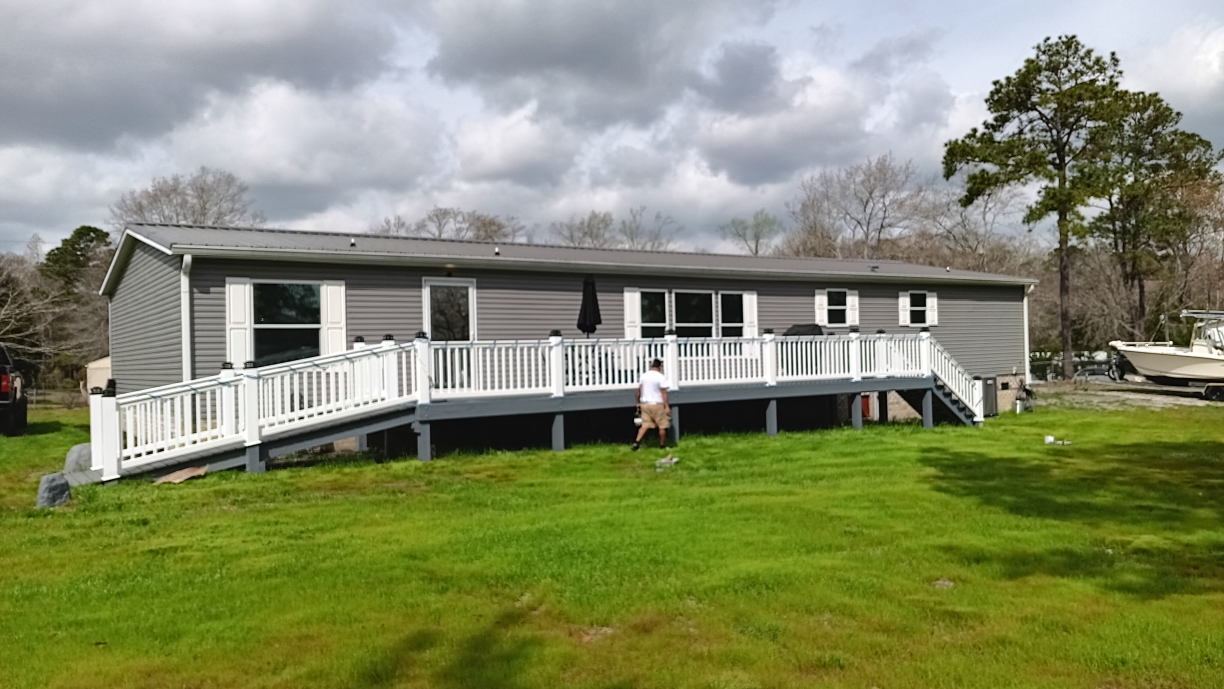 Freshly painted charcoal exterior wall with crisp white trim