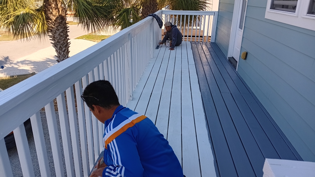 Freshly painted charcoal exterior wall with crisp white trim