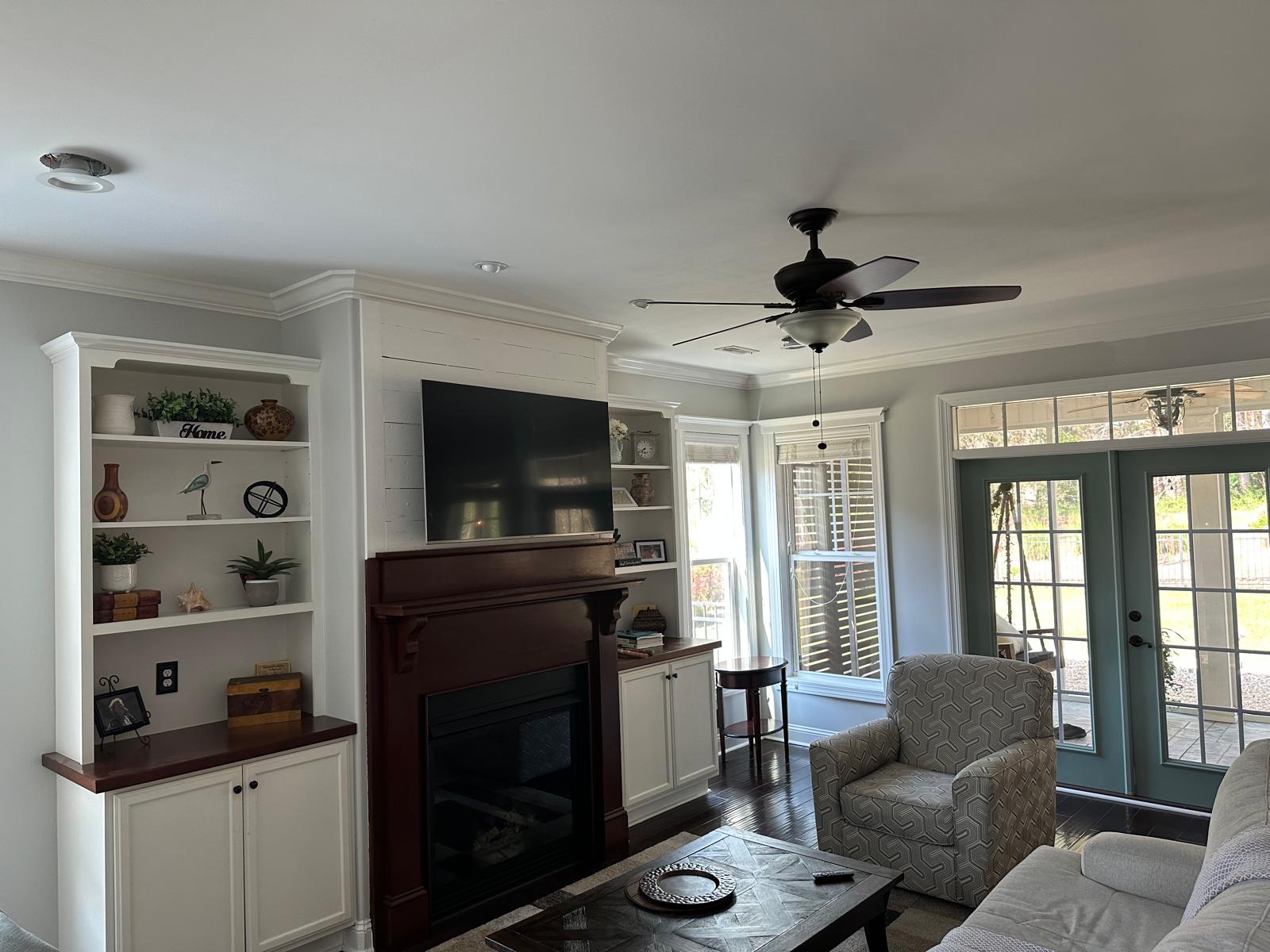 Freshly painted charcoal exterior wall with crisp white trim