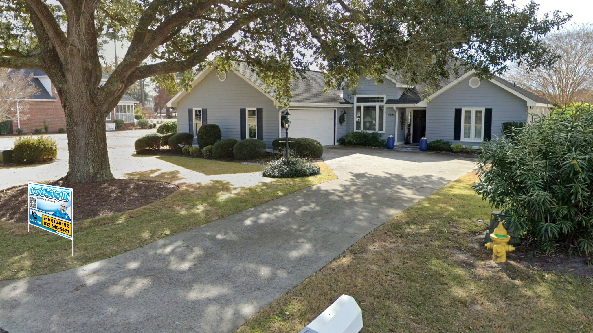 Freshly painted charcoal exterior wall with crisp white trim